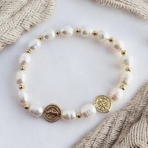 St Benito bracelet made of freshwater pearls and gold plated beads